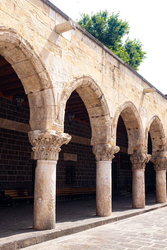 about-us Beautiful stone arches in a historic setting with intricate details and natural lighting.